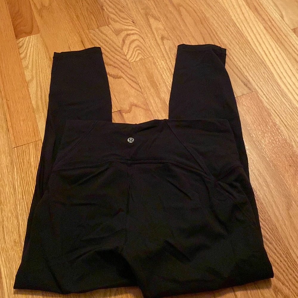 Lululemon leggings black with mesh at bottom. Size 4.